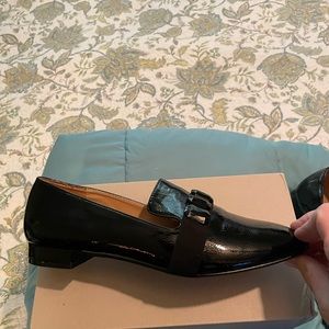 Size 11 patent leather loafers.